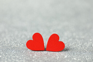 Red decorative hearts on shiny silver background. Happy Valentine's day