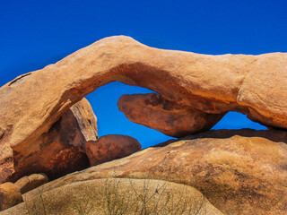 Joshua Tree National Park Arch Rock With Blue Skies In The Background
