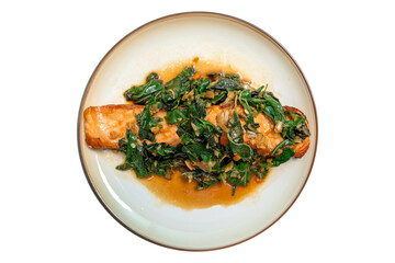 Fried fresh salmon topped with Pad Krapow. Salmon stir-fried with holy basil. Thai fusion food also known as kaprao salmon. isolated white background.