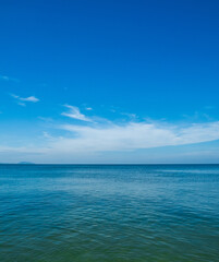 Obraz premium Photography landscape beautiful summer vertical horizon look view shore open sea beach cloud clean and blue sky background calm nature ocean wave water nobody travel at thailand chonburi sun day time
