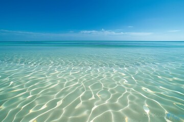 Naklejka premium Crystal clear sea water bay. Pristine ocean lagoon water and sunny cloudy sky. High quality photo