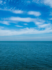 Photography landscape beautiful summer vertical horizon look view shore open sea beach cloud clean and blue sky background calm nature ocean wave water nobody travel at thailand chonburi sun day time