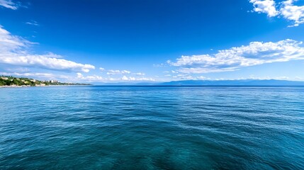 Obraz premium Stunning Coastal View of Clear Blue Ocean Under Bright Sunny Sky with Cloud Patterns : Generative AI