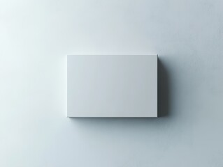 Minimalist White Box on Textured Wall, Blank Space for Product Presentation.