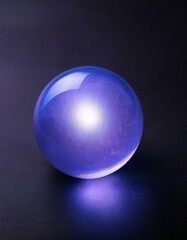 Obraz premium Glowing purple glass sphere on dark background.