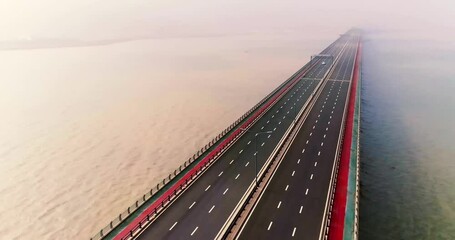 Overhead view of Tianwan Cross Sea Bridge showcasing engineering marvel and scenic coastal landscape