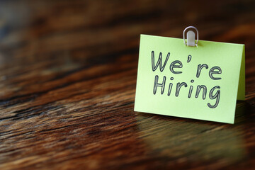 "Sticky note with the words we ' re hiring."