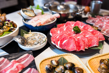 Assorted hotpot ingredients served on table