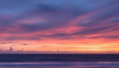Vibrant Sunset Over Ocean with Stunning Sky Colors and Clouds