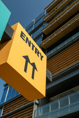 yellow entry sign on a building