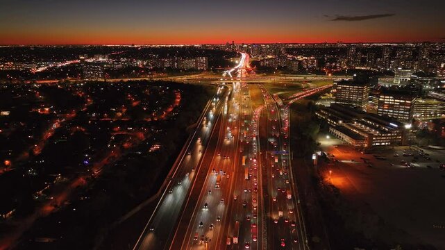 Busy highway interchange at 401 and 404 in Ontario, Canada during sunset traffic