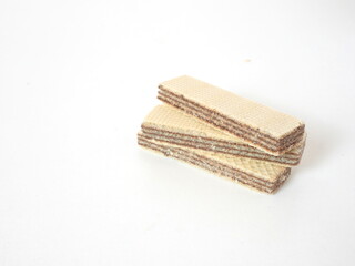 three wafers stacked on a white table