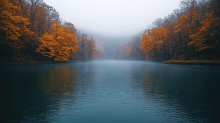 Serene autumn landscape with vibrant orange trees reflecting in a misty river