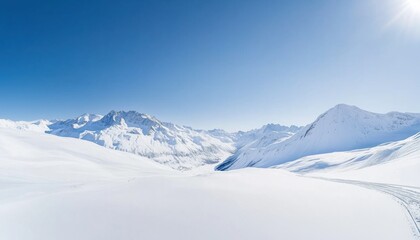 Snow-Covered Mountains Under Bright Blue Sky with Crisp Clear Air