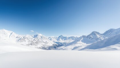 Obraz premium Expansive Snow-Covered Mountains Under Brilliant Blue Sky Evoking a Sense of Tranquility