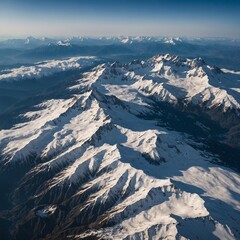 A breathtaking aerial view of a snow-covered mountain range, stretching endlessly into the horizon.