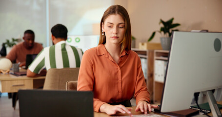 Laptop, creative business and serious woman typing in startup, research or stats for article performance. Copywriter, online or writing email on computer, planning project or check engagement metrics