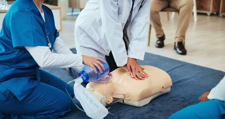 Mask, hands or nurses learning cpr on mannequin for first aid, cardiac arrest or healthcare protocol. Medical class, students or people with respiratory tool in paramedic course or nursing school