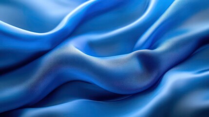 Fototapeta premium Blurred abstract background with wavy blue fabric ideal for a copy space image