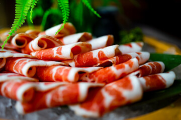 This is a plate of fresh meat slices, with bright red color and clear texture, which shows that it is a good quality meat.