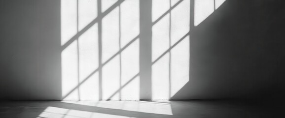 Light and shadow from window on wall.