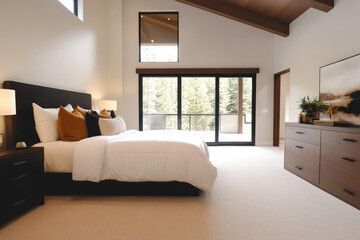 Fototapeta premium Chic modern bedroom interior design with large windows and natural light in serene setting