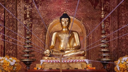 Obraz premium Serene Golden Buddha Statue Surrounded by Intricate Decor Elements