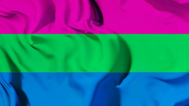 The polysexual flag proudly waving in the wind, symbolizing visibility, acceptance, and the celebration of diverse identities during Pride events.