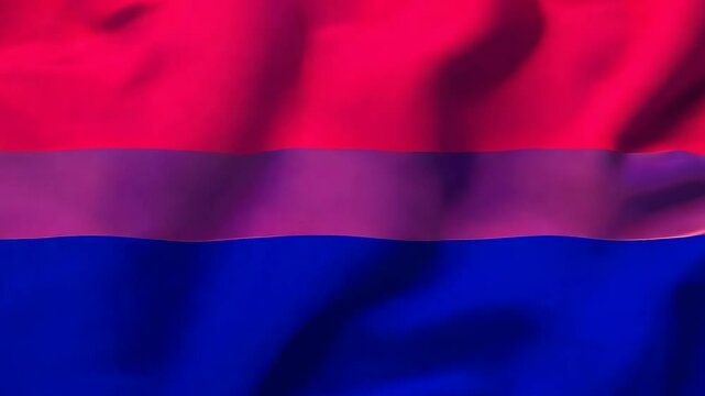 The bisexual flag proudly waving in the wind, symbolizing visibility, acceptance, and the celebration of bisexual identity during Pride events.