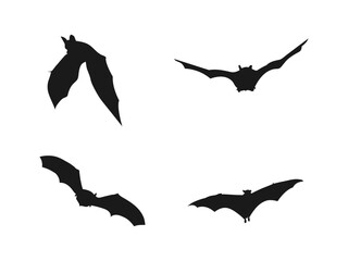 Spooky silhouette of a flock of bats flying across a starry night sky. Flying vampire bat silhouettes for Halloween. Halloween black bats flying silhouettes isolated on a white background.