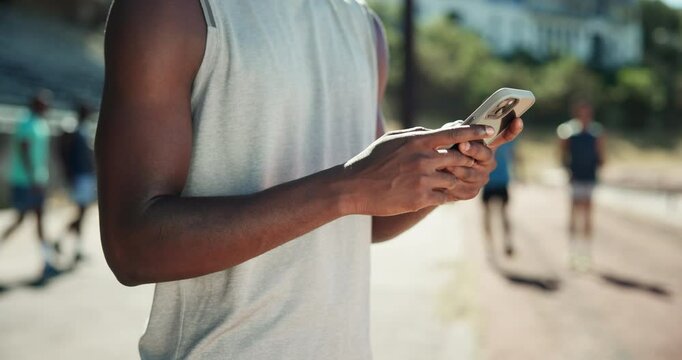 Man, hands and typing with phone for fitness app, schedule exercise or workout routine at stadium. Closeup, male person or runner with mobile smartphone for sport, training tips or online search