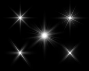 Glowing white sparkles light effect on dark background. Flare, explosion, stars, starbursts, rays