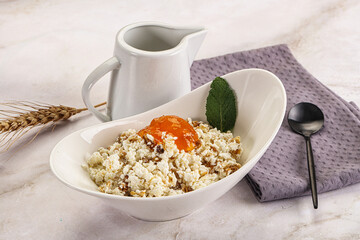 Curd with granola and orange jam