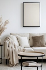 Modern living room setup featuring a cozy beige sofa, neutral cushions, stylish coffee table, and empty poster frame ready for art display. Home decor inspiration.