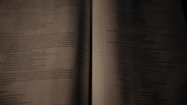 Light rays shining and passing over a christian bible