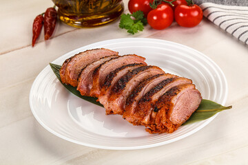 Sliced duck breast baked with cherry