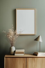 Modern living room setup featuring a wooden sideboard, minimalist lamp, decorative vase, and blank wall art poster mockup for easy customization. Home decor inspiration.