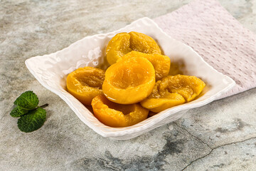 Canned marinated peach in syrop