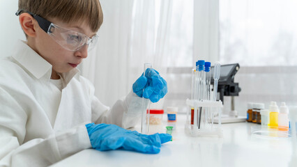 An apprentice in a chemical laboratory conducts chemical experiments