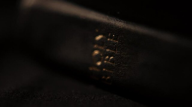 Light rays shining and passing over a christian bible