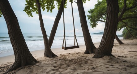 Serene Beach Swing Nestled Between Trees with Ocean View and Sandy Shoreline