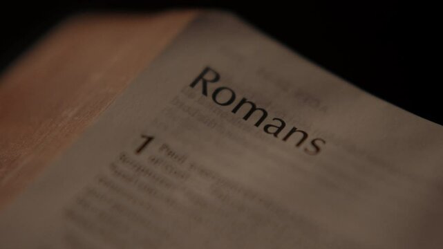 Light rays shining and passing over a christian bible