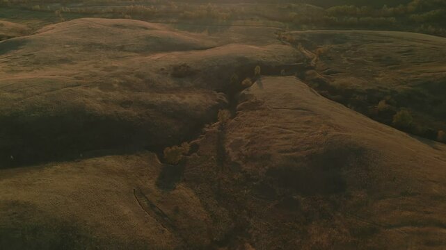Autumn sunset over hills and river valley