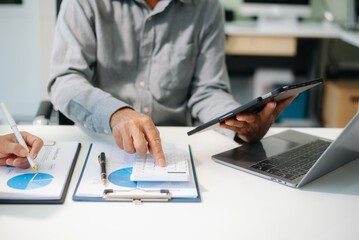 Business people making presentation with his colleagues and business tablet digital computer
