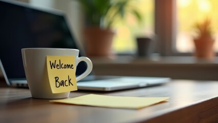 Warm welcome on desk with coffee mug and a laptop after time away