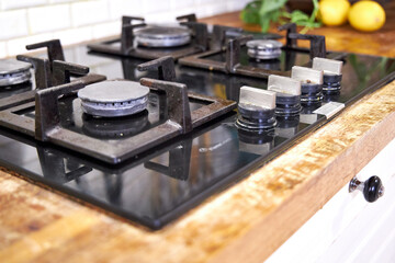 a woman washes a black glass slab with a wooden brush, eco-friendly cleaning