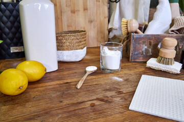 natural detergents and wooden dishwashing brushes in the kitchen