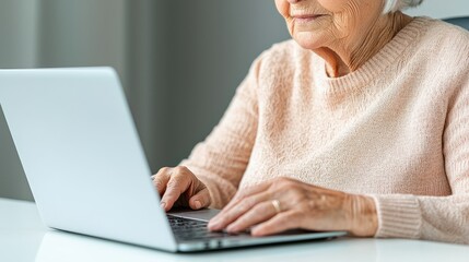 Increase Allowances for the Elderly Concept, Senior Woman Using Laptop to Access Financial Information and Advisor Services for Better Financial Decisions