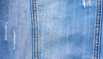 Texture of a blue stone-washed denim fabric
