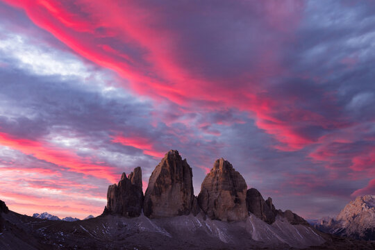 Majestic purple sunset on Three Peaks of Lavaredo mountains group